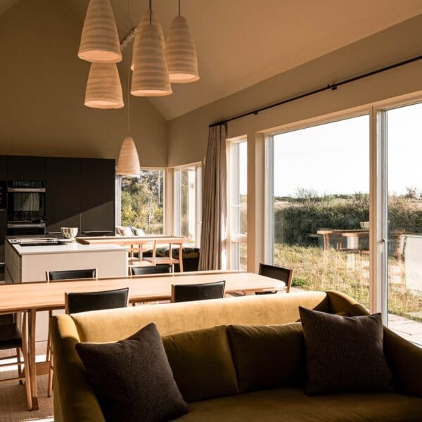 Open plan living, dining room and kitchen with large patio doors