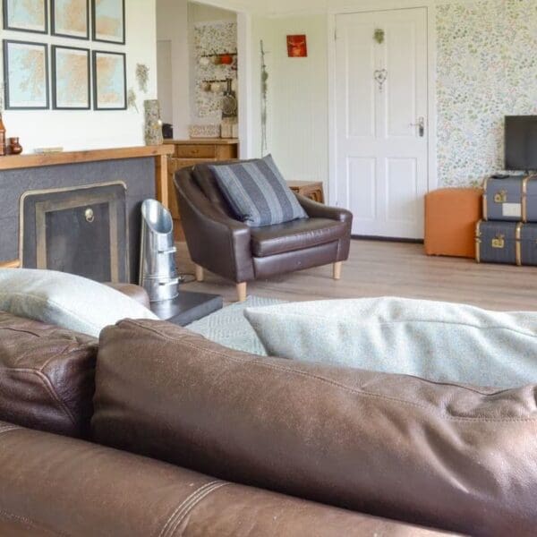 Living room with brown leather suite, Wester Lonemore, Dornoch