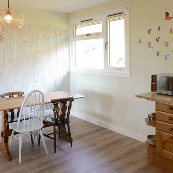 Dining area of kitchen with pine top table, Wester Lonemore, Dornoch