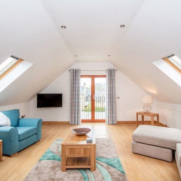 Lounge and balcony door, The Hive holiday apartment, Dornoch