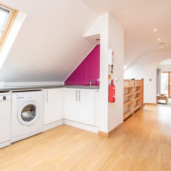 Kitchen with view through dining area to living room, The Hive holiday apartment, Dornoch