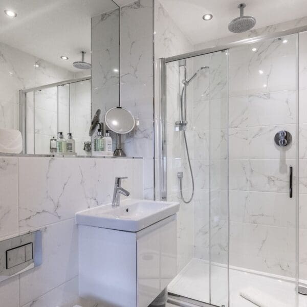 shower room with white marble tiles, 13 Royal Golf Apartments Dornoch
