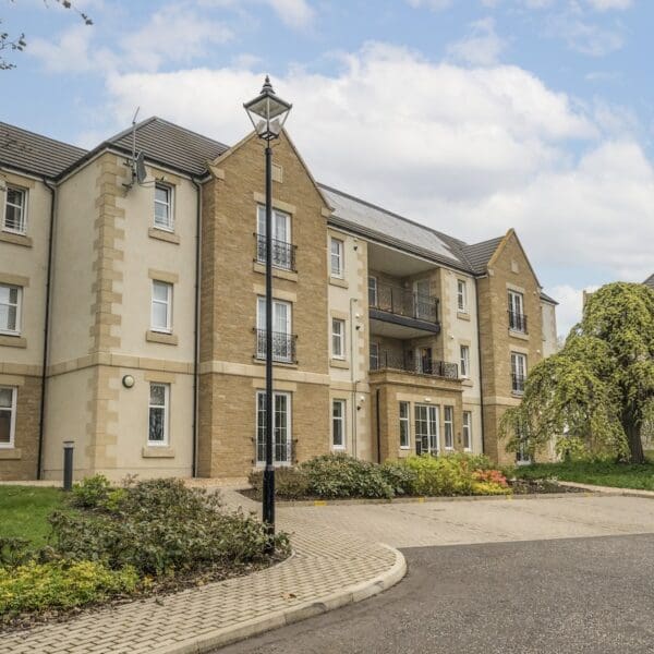 Exterior of 13 Royal Golf Apartments Dornoch with sandstone feature walls and balconies