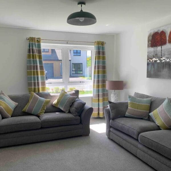Lounge with two grey sofas, 8 Allan Gardens Dornoch