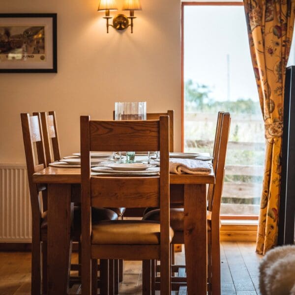 Wooden dining table and chairs in Grieve's Cottage, Skelbo Dornoch