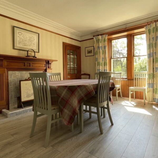 Dining room table in kitchen of Balloan House, Dornoch