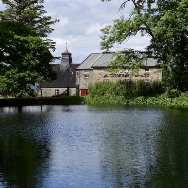 Glenmorangie Distillery exterior next to pond 1600 x 900