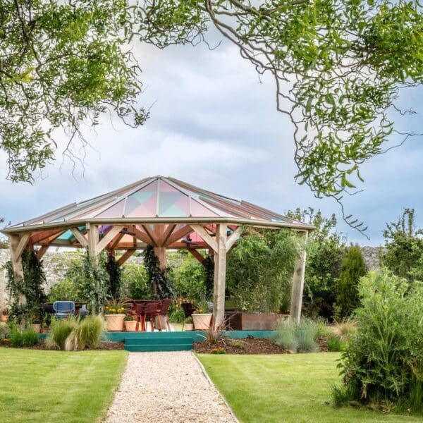 Glass roofed gazebo in garden of Glenmorangie House Hotel