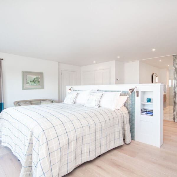 Double bedroom with central bed and built in headboard, Oran Mor, self catering house in Skelbo, Dornoch