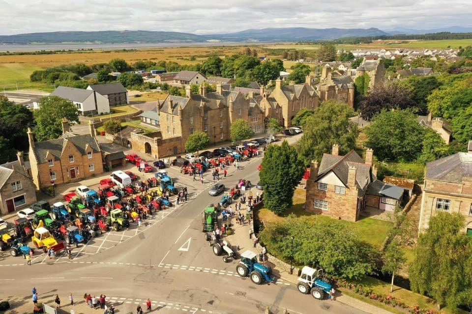 Aerial view of Dornoch Square looking south west with Tractors parked for charity event