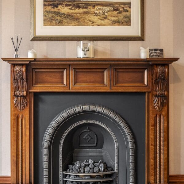 Iron fireplace with pitch pine surround